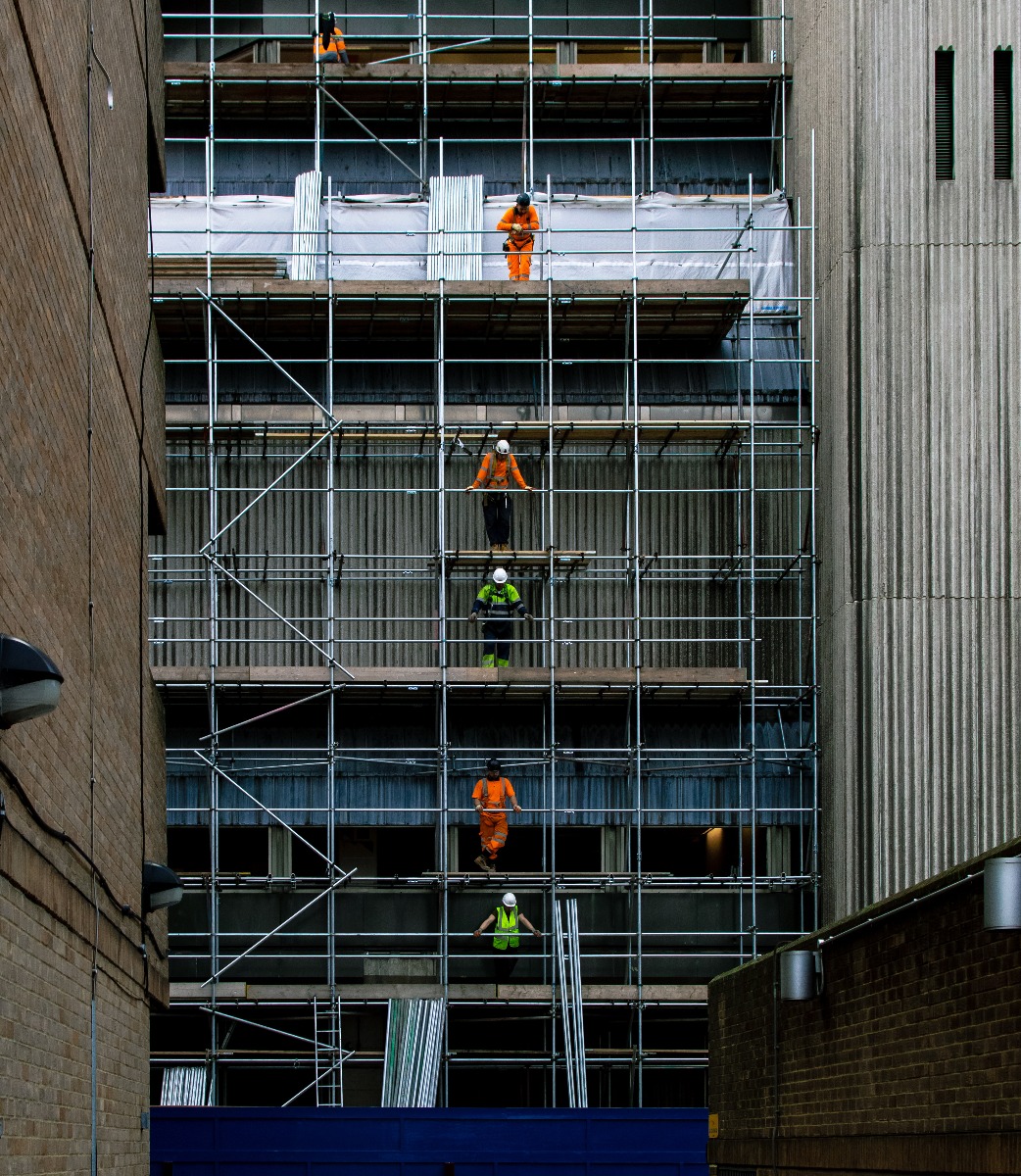 construction_site_with_plastic_sheeting_and_workers_v2